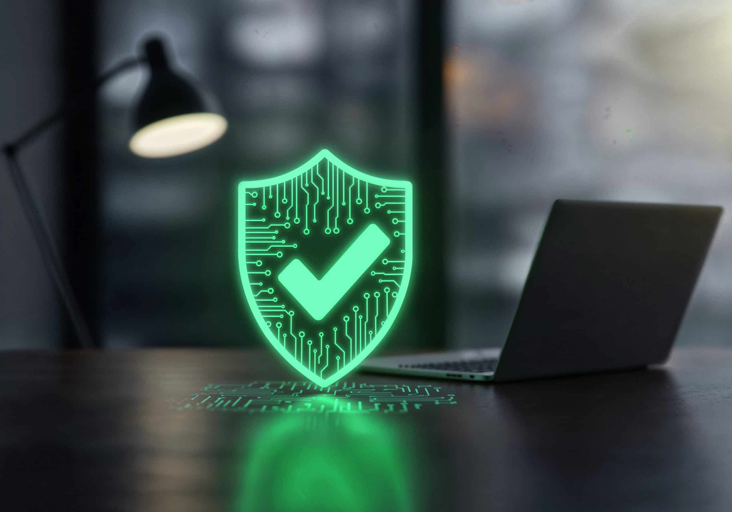 cloud backup,sauvegarde cloud TPE,sauvegarde de données PME- cybersecurity shield protecting laptop scaled